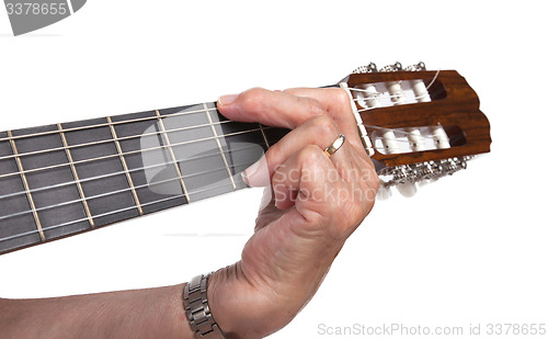 Image of Old hand and guitar isolated