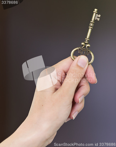 Image of hand with key