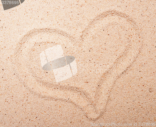 Image of heart on sand