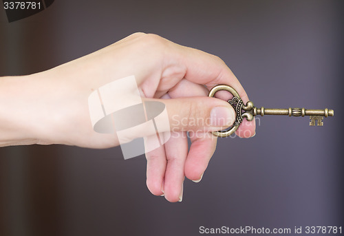 Image of hand with key