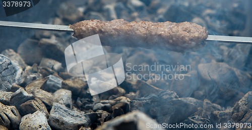 Image of cooking meat on the coals