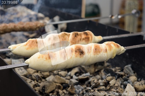 Image of cooking meat on the coals