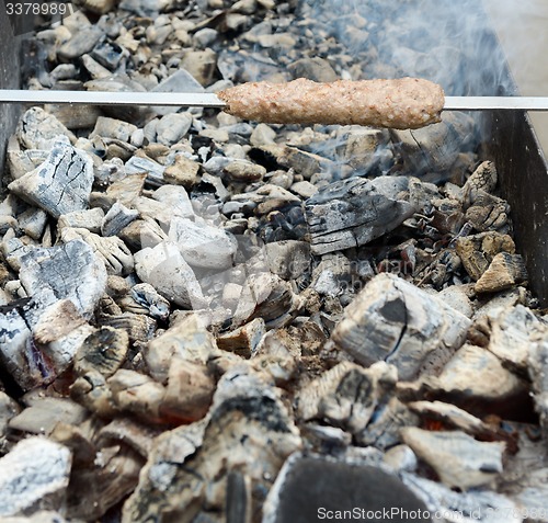 Image of cooking meat on the coals