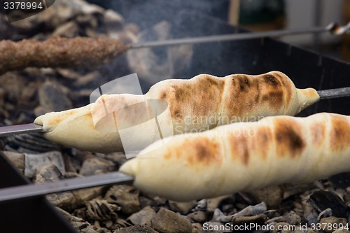 Image of cooking meat on the coals