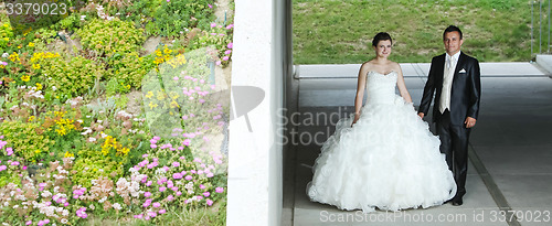 Image of Bride and groom posing under the overpass