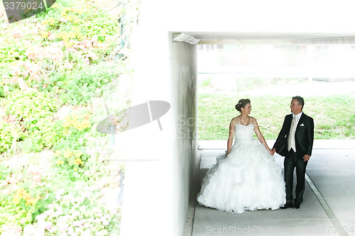Image of Newlyweds under the overpass