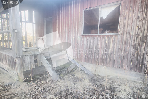 Image of destroyed house  porch and entrance ruins