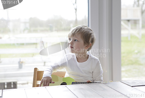 Image of little boy with guitar