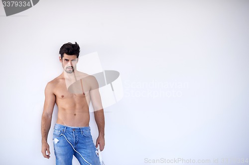 Image of handsome young man listening music on headphones