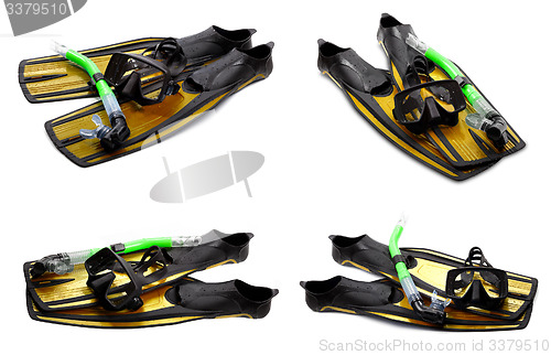 Image of Set of yellow swim fins, mask and snorkel for diving on white ba