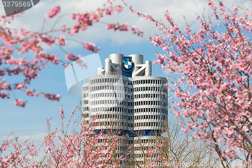 Image of Tower building BMW head office framed pink spring flowering bran