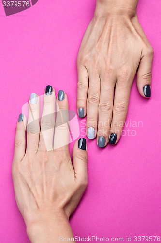 Image of Delicate female hands with a stylish neutral manicure