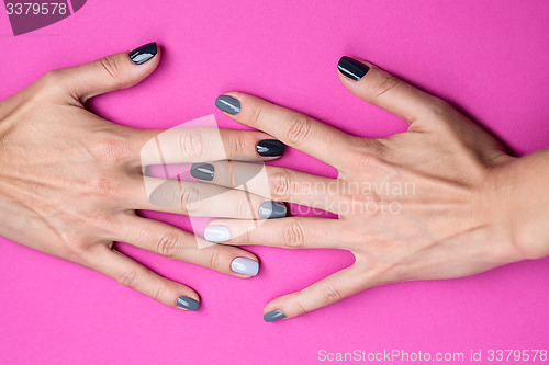 Image of Delicate female hands with a stylish neutral manicure