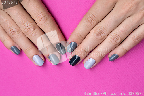 Image of Delicate female hands with a stylish neutral manicure