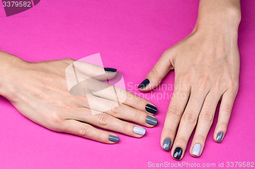 Image of Delicate female hands with a stylish neutral manicure