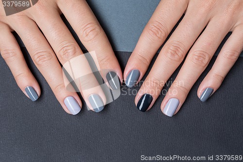 Image of Female hands with a stylish neutral manicure