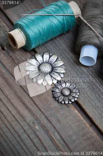 Image of spools of threads and vintage buttons