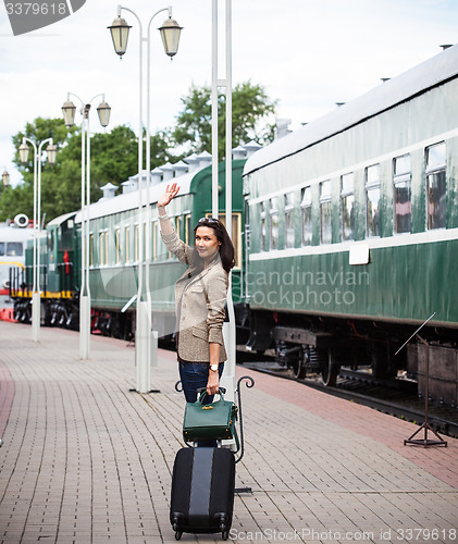 Image of Woman traveler with luggage