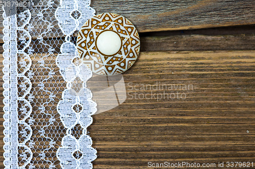 Image of vintage lace with a brooch