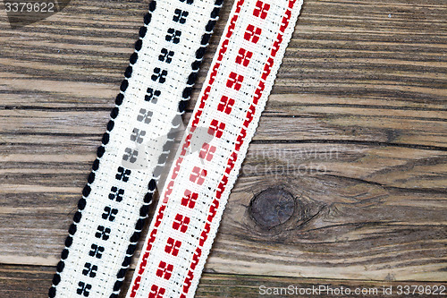 Image of two vintage band with embroidered ornaments