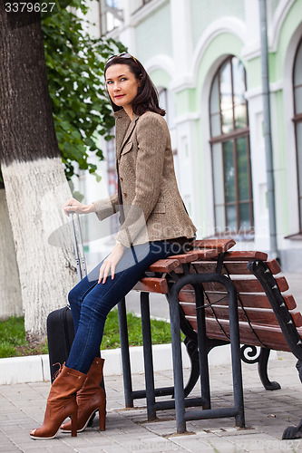 Image of beautiful business woman goes on a journey