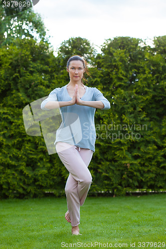 Image of beautiful woman doing yoga