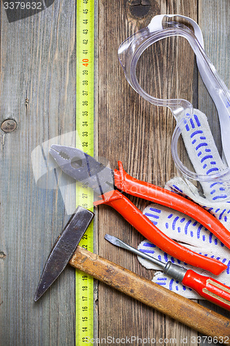 Image of vintage tool set and safety gloves and glasses