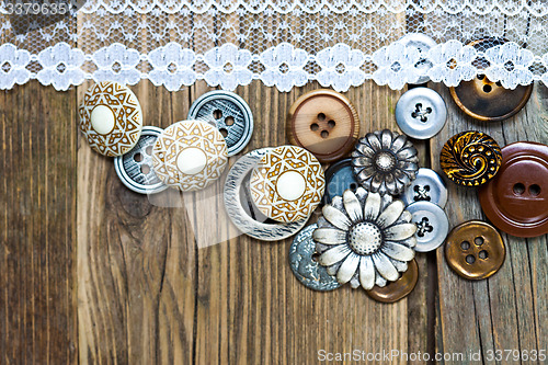 Image of vintage buttons and lace tape