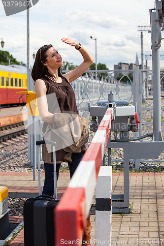 Image of woman near barrier at the border