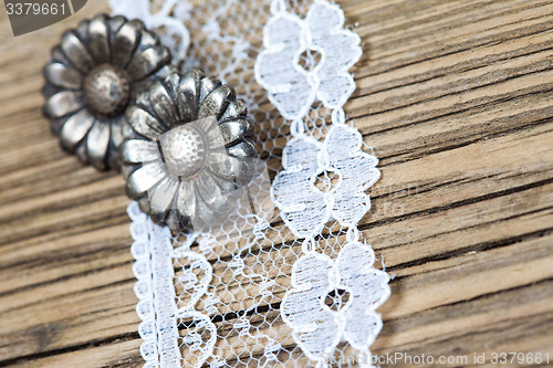 Image of vintage button and lace tape