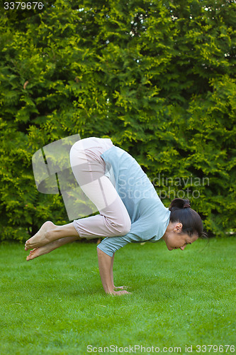 Image of pretty woman doing yoga