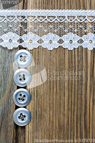 Image of vintage button and lace tape