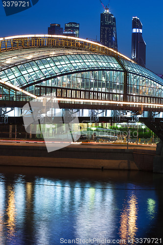 Image of Moscow night cityscape wint part of covered bridge