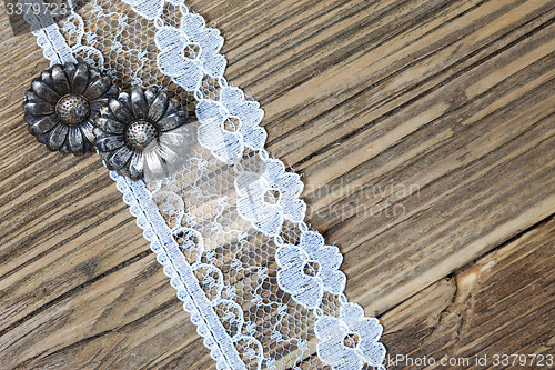 Image of vintage button and lace tape