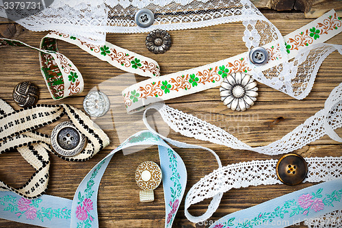 Image of ribbons, lace, tape and buttons