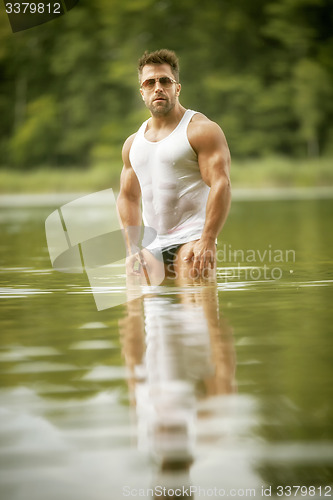 Image of muscular man lake