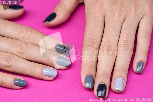 Image of Delicate female hands with a stylish neutral manicure