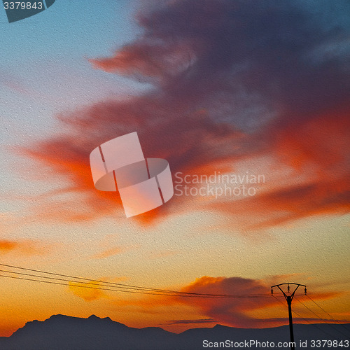 Image of mountain in morocco africa   current cables     and red sunrise