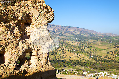 Image of cemetery  high in the village   constructions