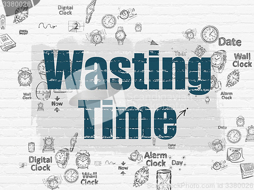 Image of Time concept: Wasting Time on wall background
