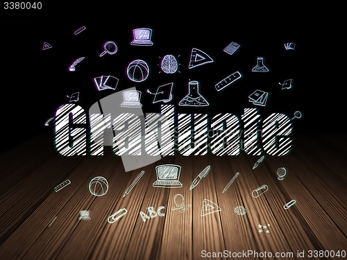 Image of Learning concept: Graduate in grunge dark room