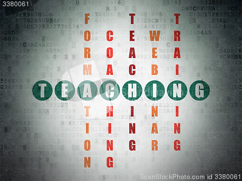 Image of Education concept: word Teaching in solving Crossword Puzzle