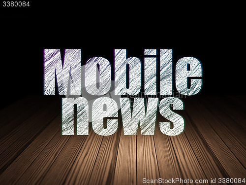 Image of News concept: Mobile News in grunge dark room