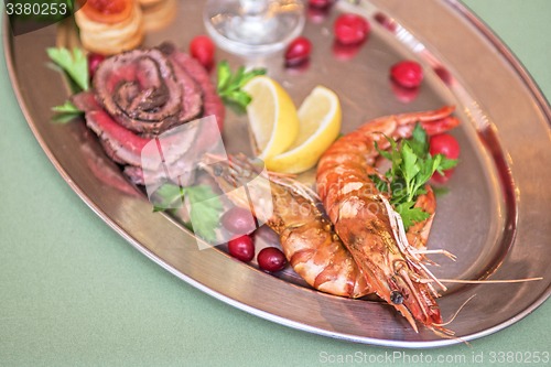 Image of Grilled shrimps and beef meat 