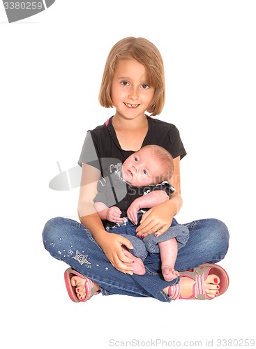 Image of Young girl with three weeks old baby.