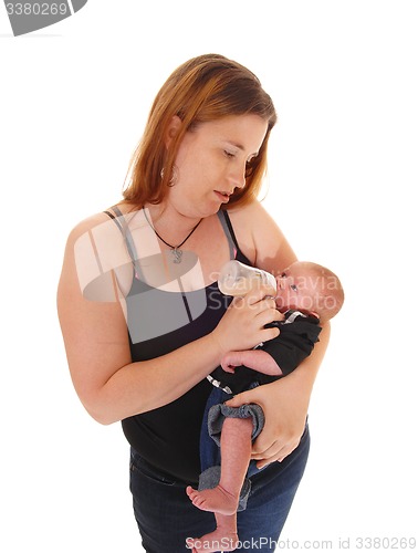 Image of Mother feeding her three weeks old baby.