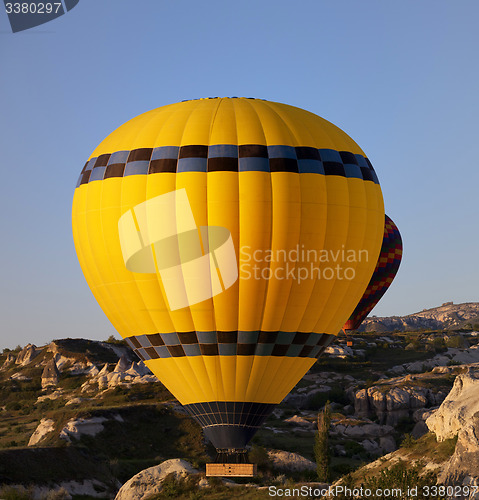 Image of Hot air balloons in mountains at early morning