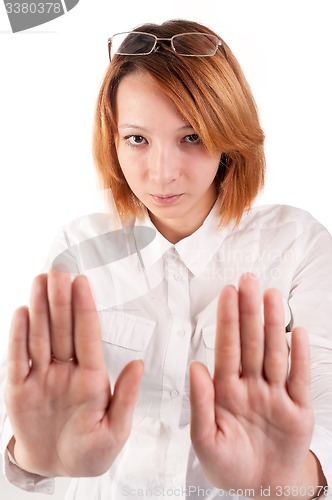 Image of Attractive red-haired lady making stop gesture