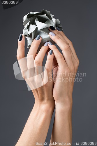 Image of Stylish manicure in shades of gray female elegant handles.