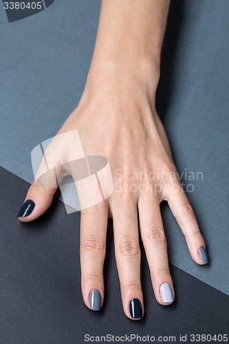 Image of Female hand with a stylish neutral manicure